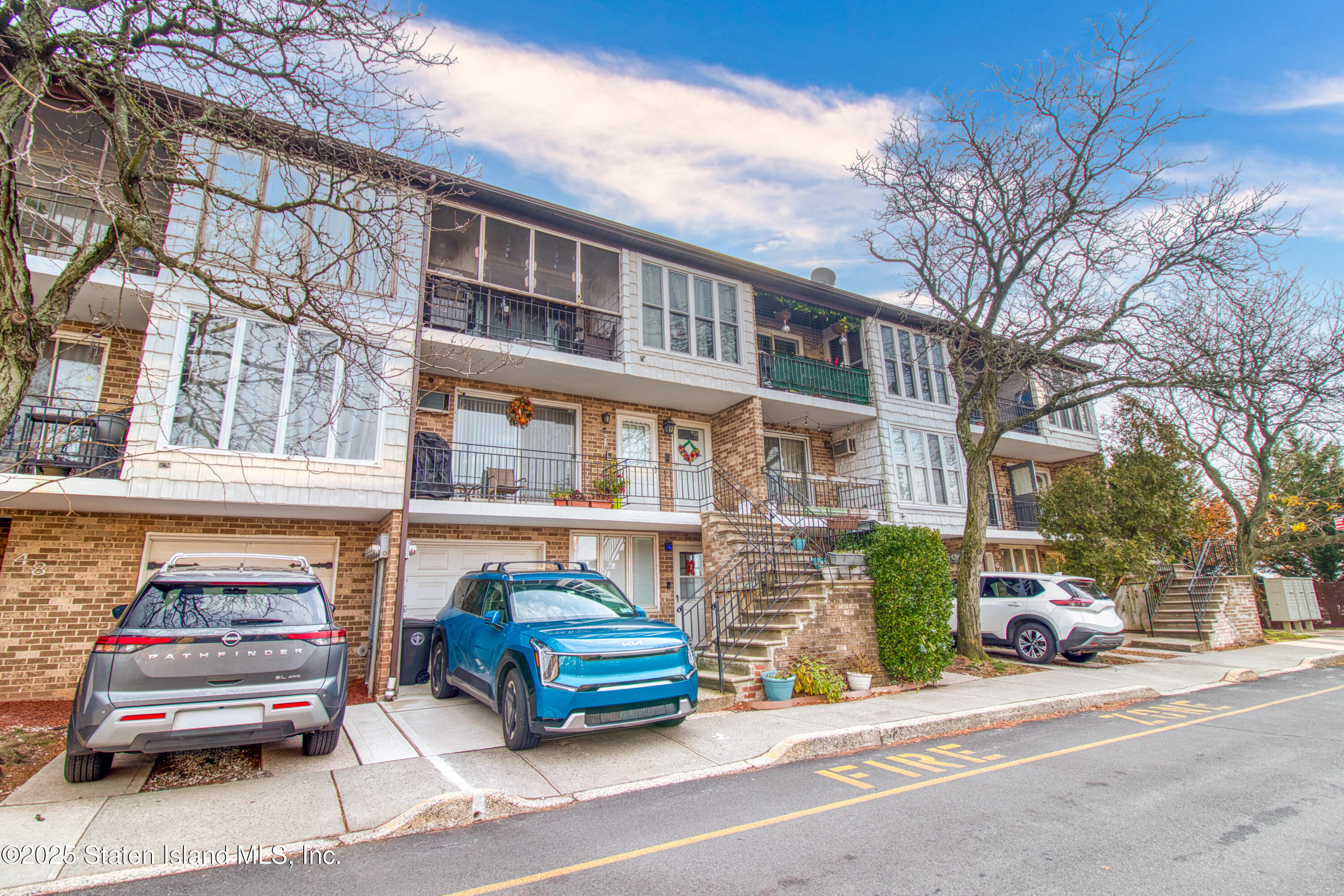 52 Racal Court, Unit A2 Staten Island, NY 10314 - Photo 28 of 28 a car parked in front of a building