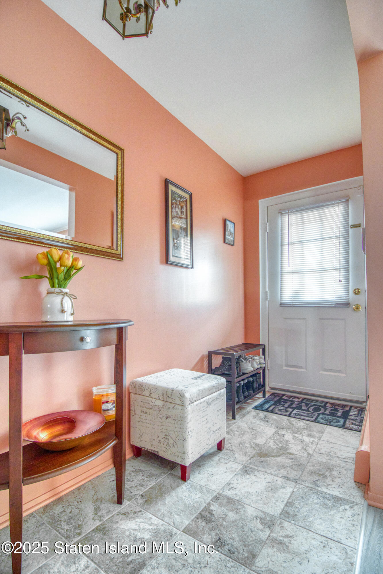 52 Racal Court, Unit A2 Staten Island, NY 10314 - Photo 3 of 28 a living room with furniture and a table