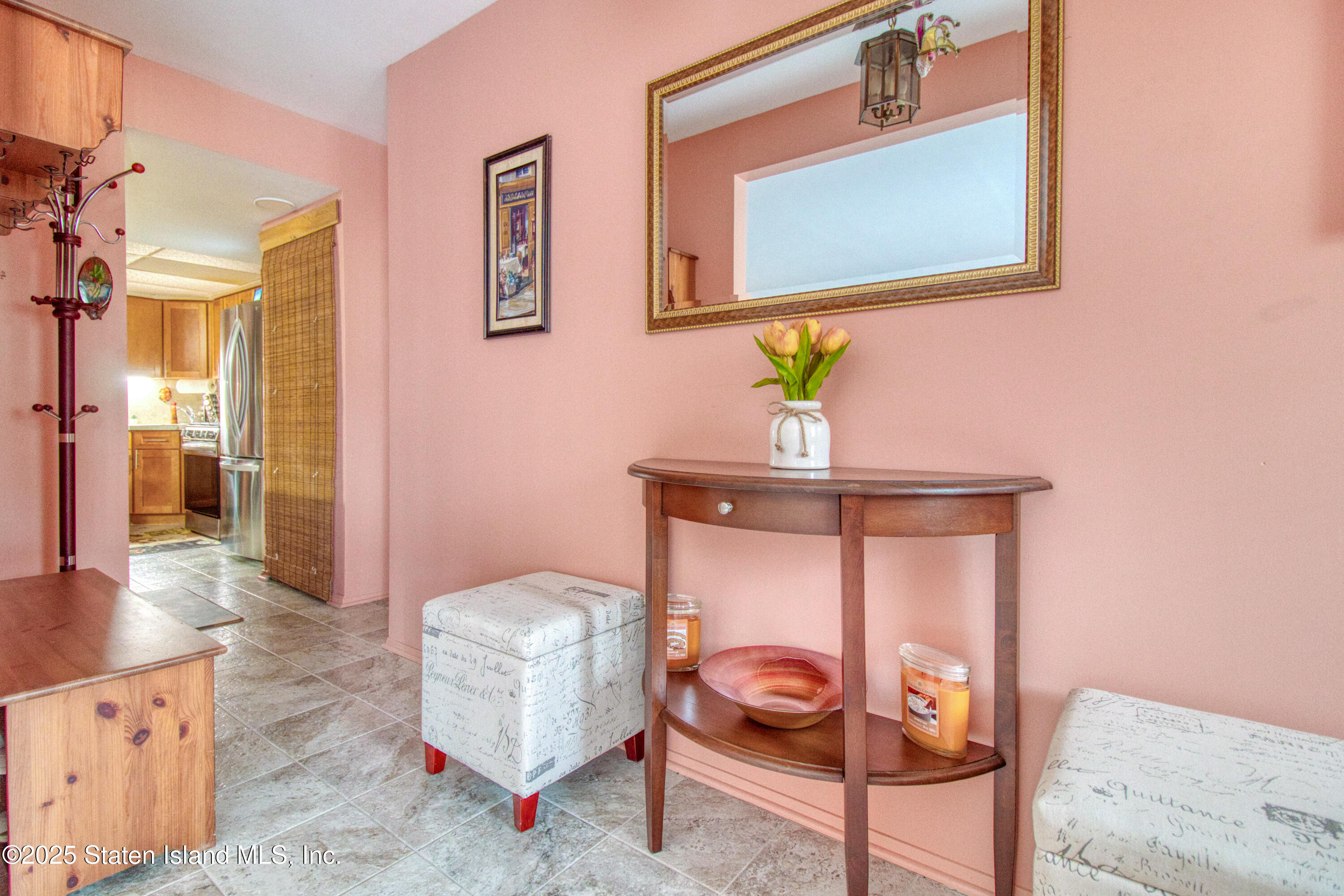 52 Racal Court, Unit A2 Staten Island, NY 10314 - Photo 6 of 28 a living room with furniture and a wooden floor