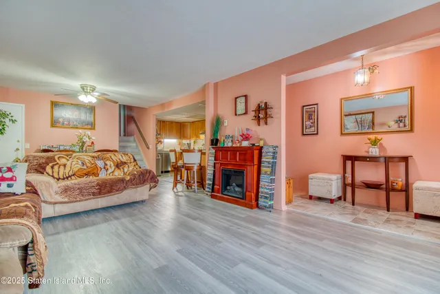 a spacious bedroom with a bed and wooden floor