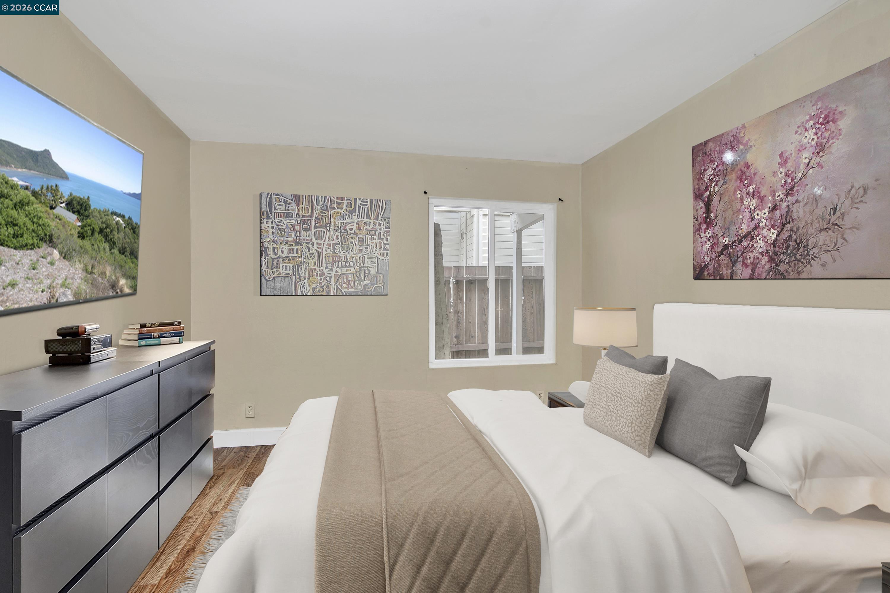 4888 Clayton Road, Unit 6 Concord, CA 94521 - Photo 12 of 16 a bedroom with a bed and a window