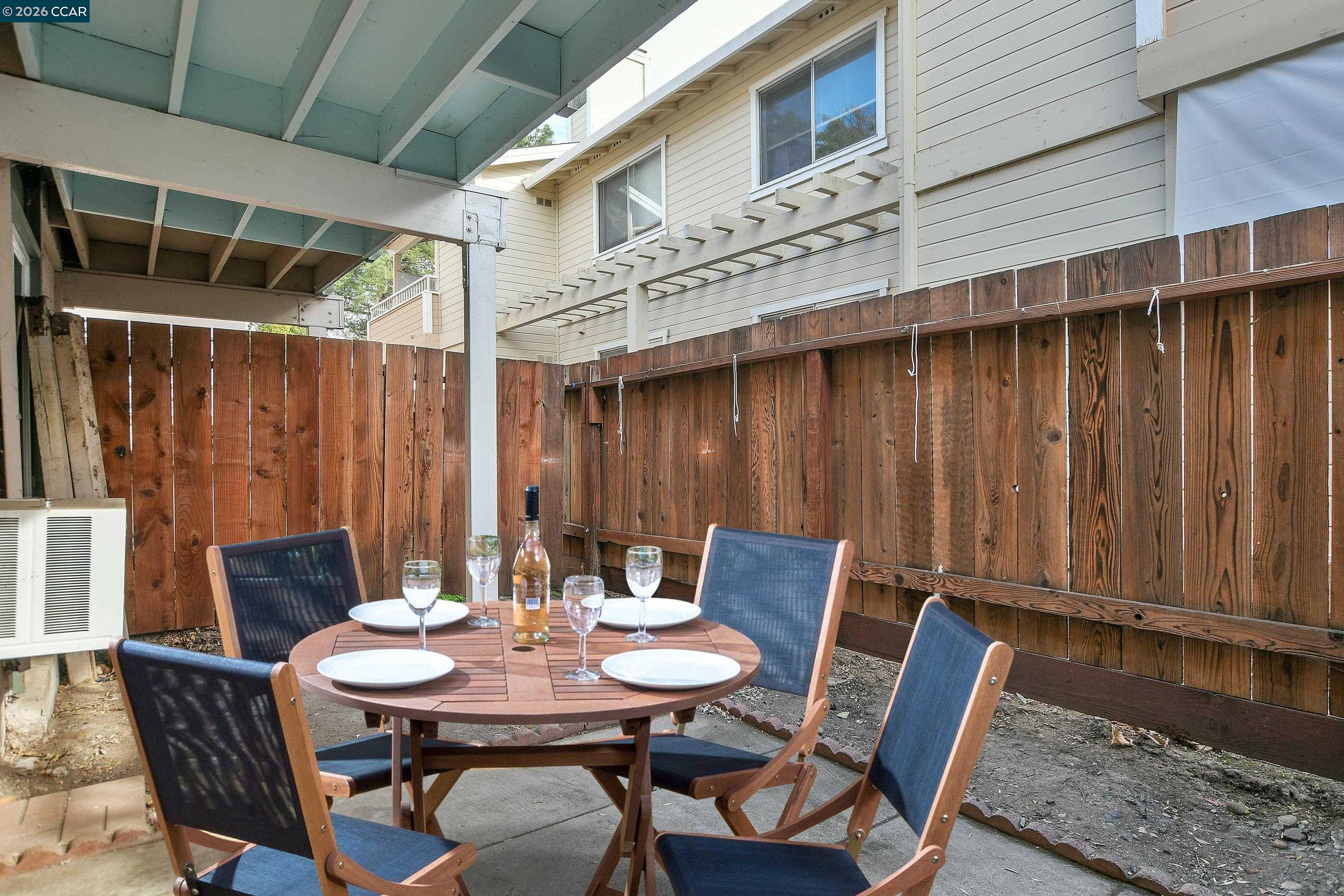 4888 Clayton Road, Unit 6 Concord, CA 94521 - Photo 14 of 16 a view of a table and chairs in patio