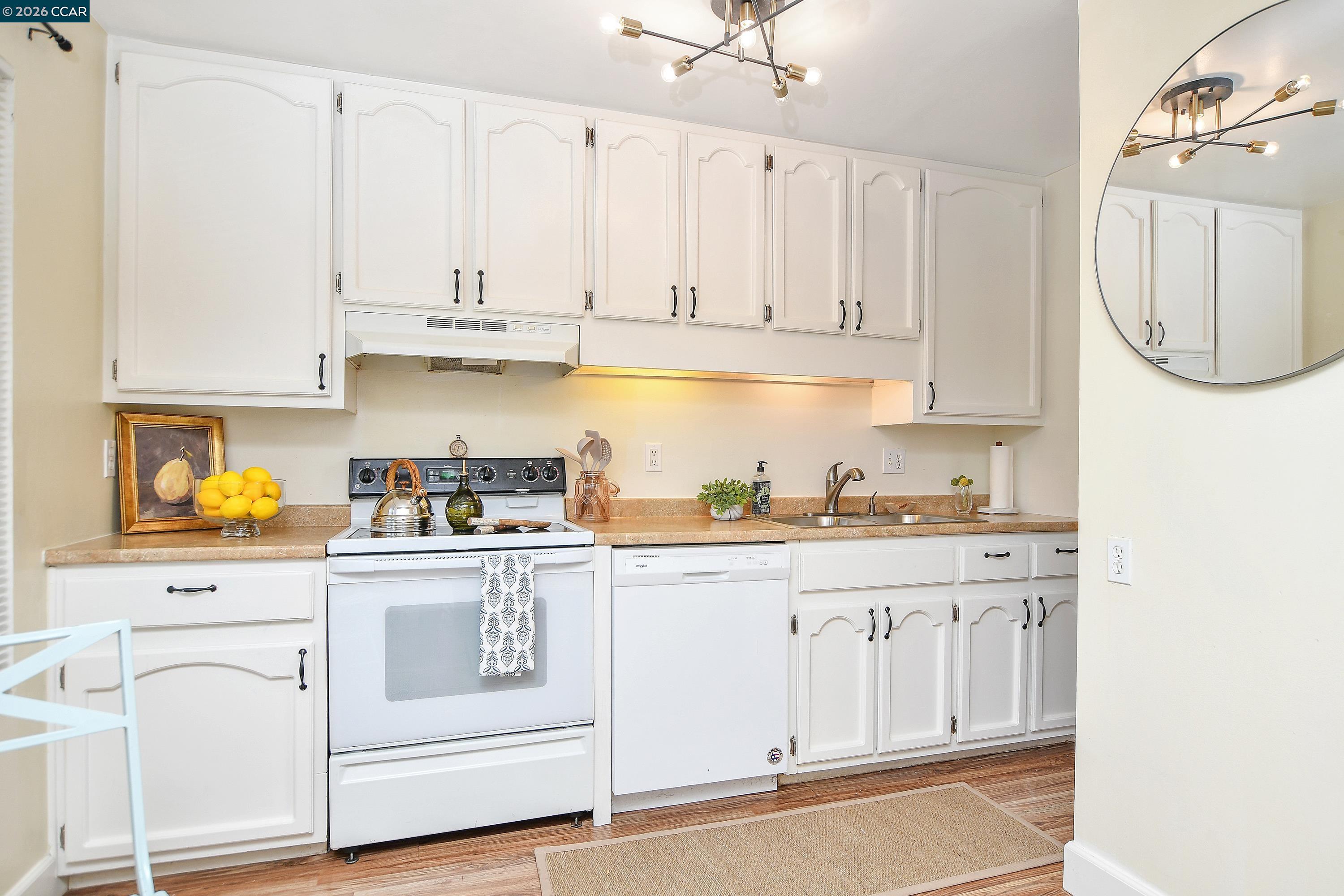 4888 Clayton Road, Unit 6 Concord, CA 94521 - Photo 8 of 16 a kitchen with white cabinets and white appliances