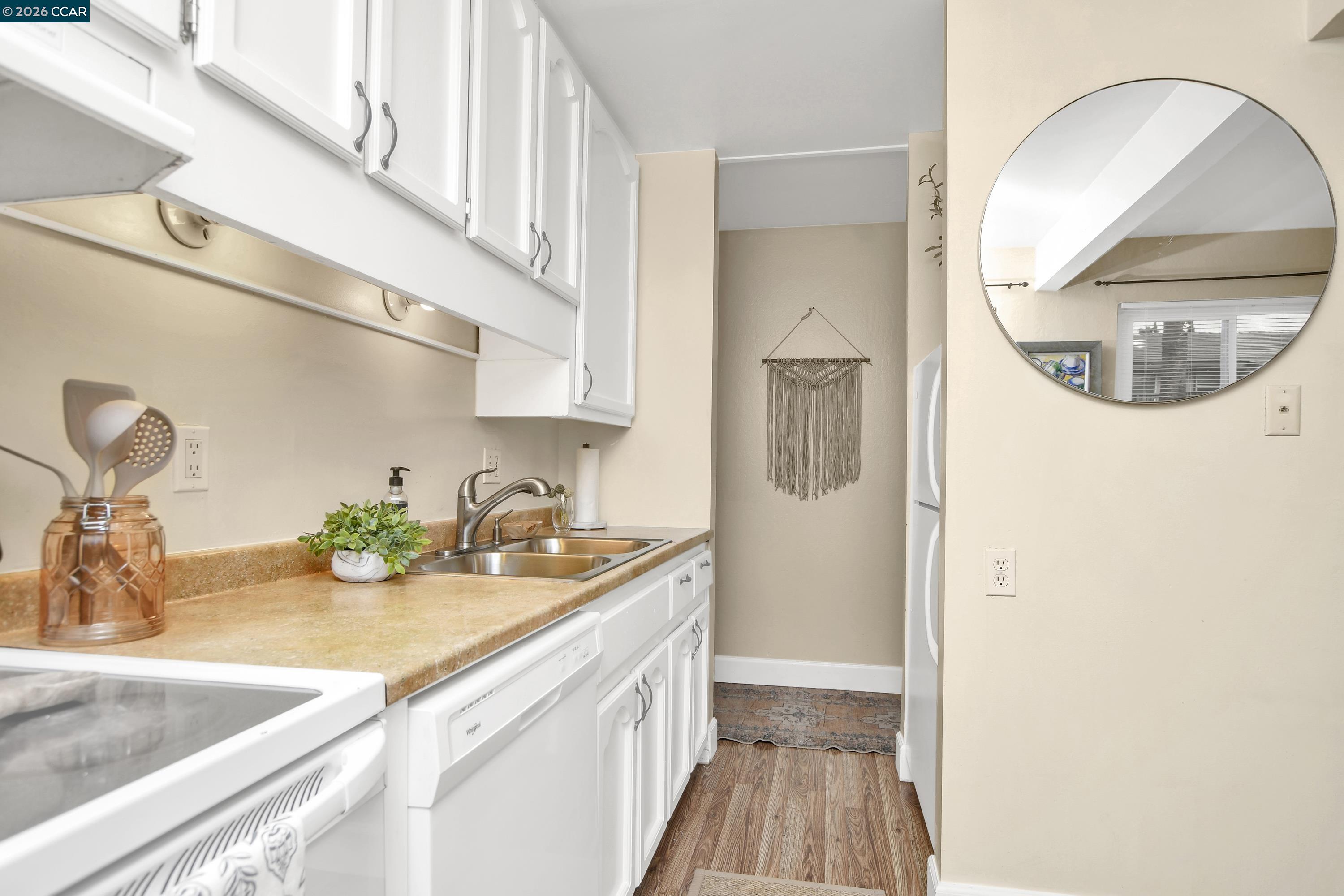 4888 Clayton Road, Unit 6 Concord, CA 94521 - Photo 9 of 16 a bathroom with a sink and a mirror