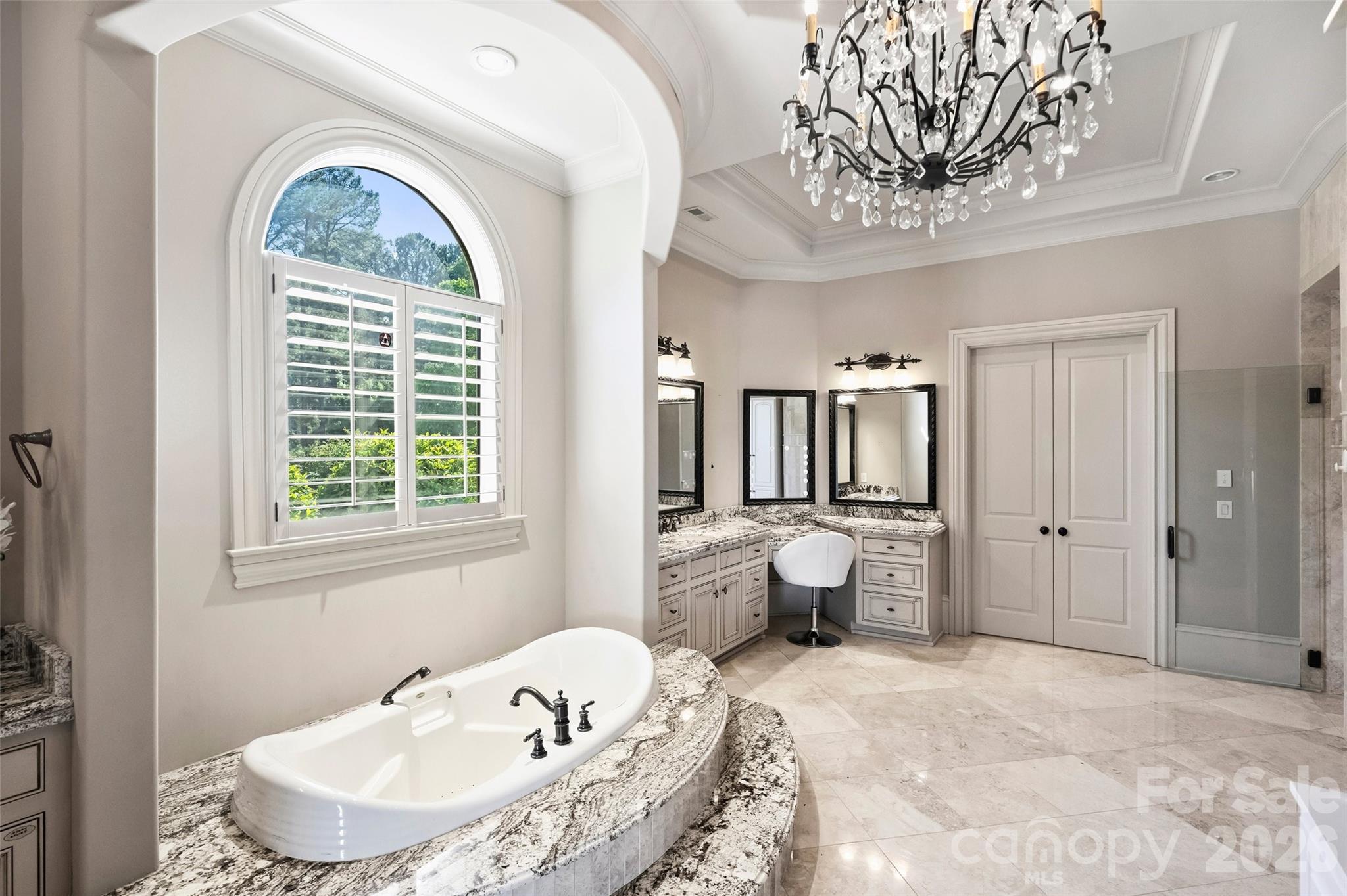 18394 Nantz Road Cornelius, NC 28031 - Photo 28 of 47 a spacious bathroom with a bathtub and a window