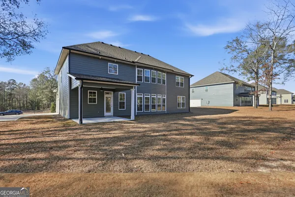 a front view of a house with a yard