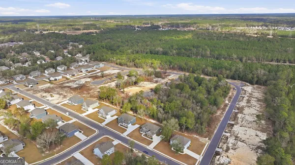 an aerial view of house with yard