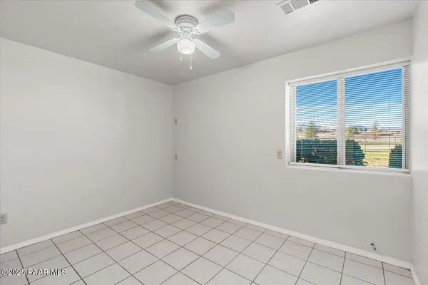 a view of an empty room and window