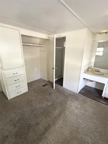 a view of an empty room with cabinet