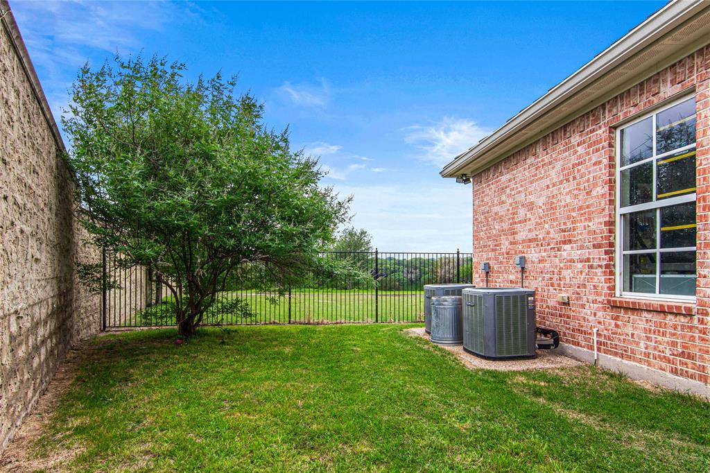 40 Enclave Court Waco, TX 76708 - Photo 33 of 40 a view of backyard with barbeque grill and plants