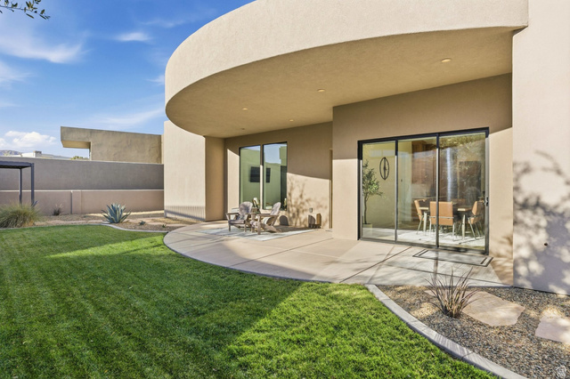 2197 Reserve Circle St. George, UT 84770 - Photo 52 of 57 Rear view of house with stucco siding and a patio area
