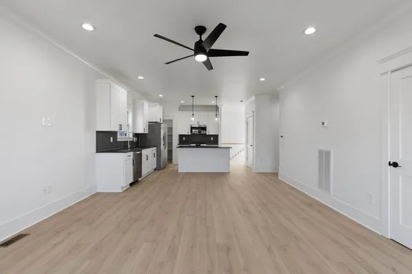 a view of a balcony with wooden floor