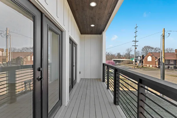 a view of a balcony with wooden floor