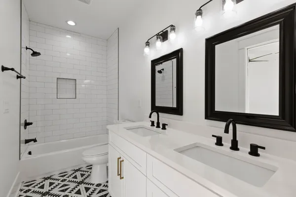a kitchen with a refrigerator sink and stove