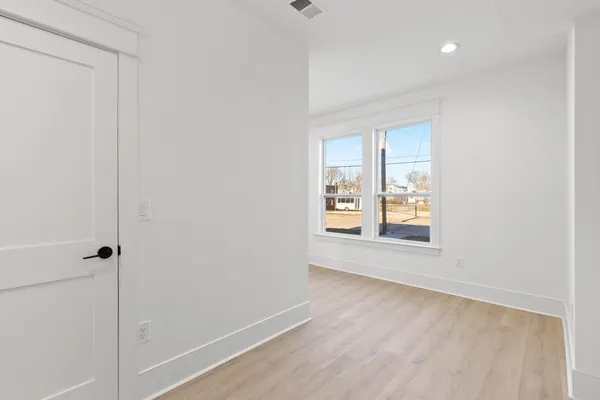 a kitchen with stainless steel appliances granite countertop a sink a stove and a refrigerator