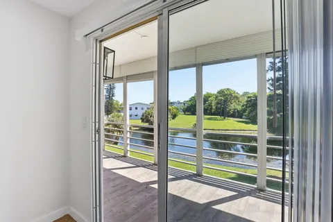 a view of a glass door and a living room