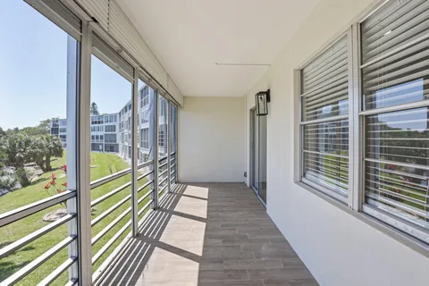a view of balcony and wooden floor