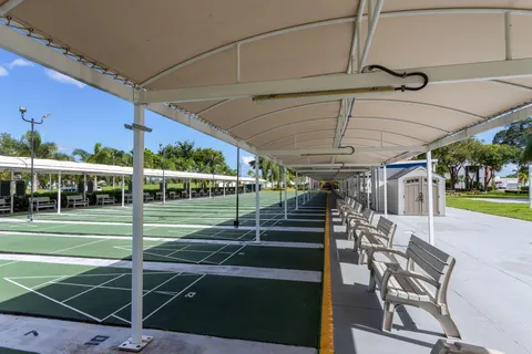 a view of a swimming pool with a patio