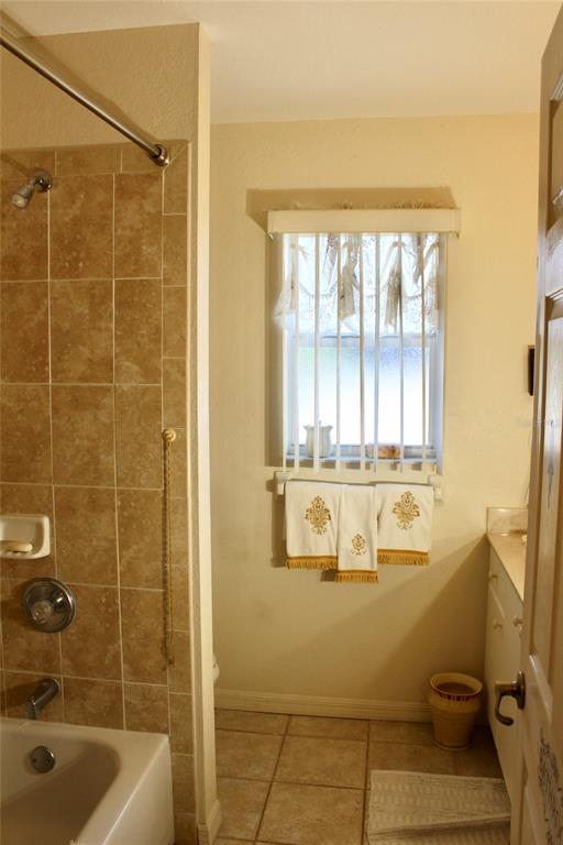 74 Belem Street Punta Gorda, FL 33983 - Photo 12 of 34 a bathroom with a tub a sink and a shower