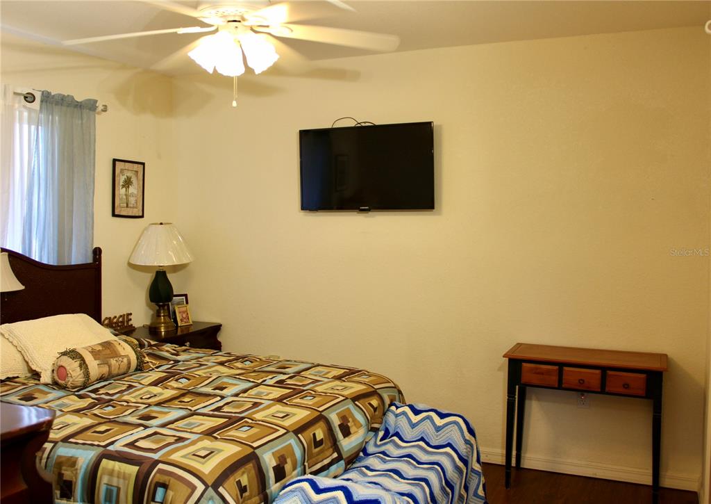 74 Belem Street Punta Gorda, FL 33983 - Photo 14 of 34 a bedroom with a bed and a flat screen tv