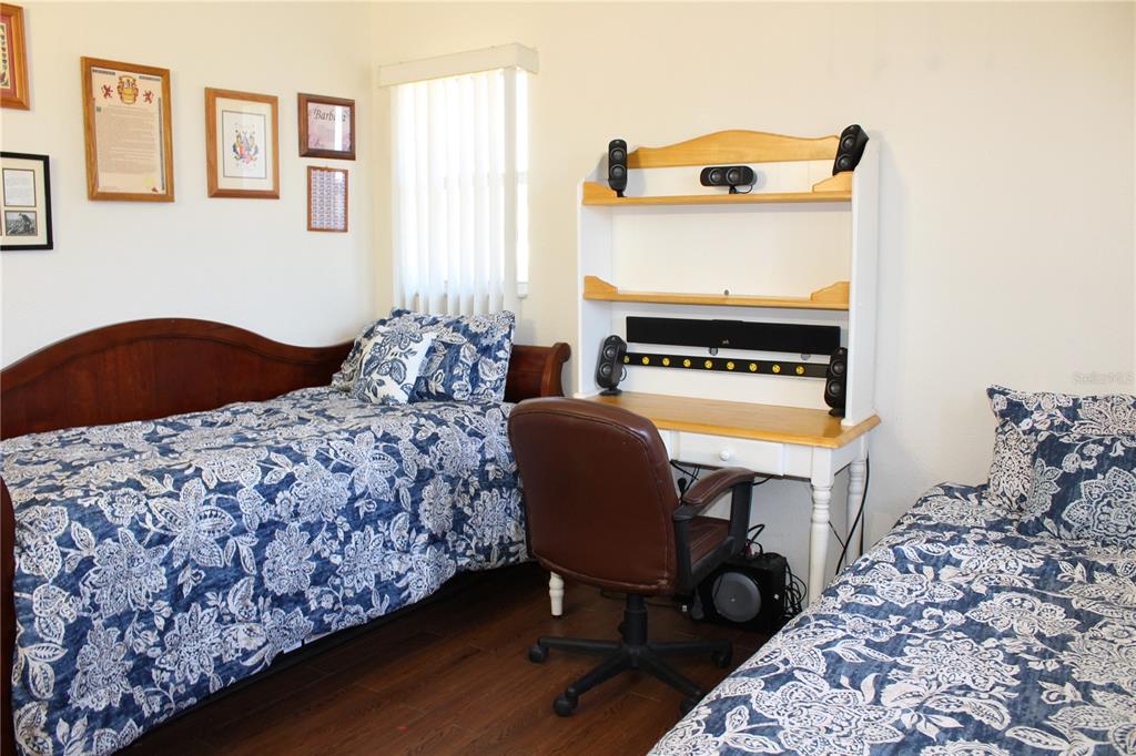 74 Belem Street Punta Gorda, FL 33983 - Photo 17 of 34 a bedroom with a bed and a table