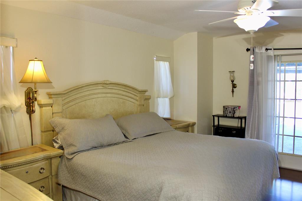 74 Belem Street Punta Gorda, FL 33983 - Photo 23 of 34 a bedroom with a bed and a window