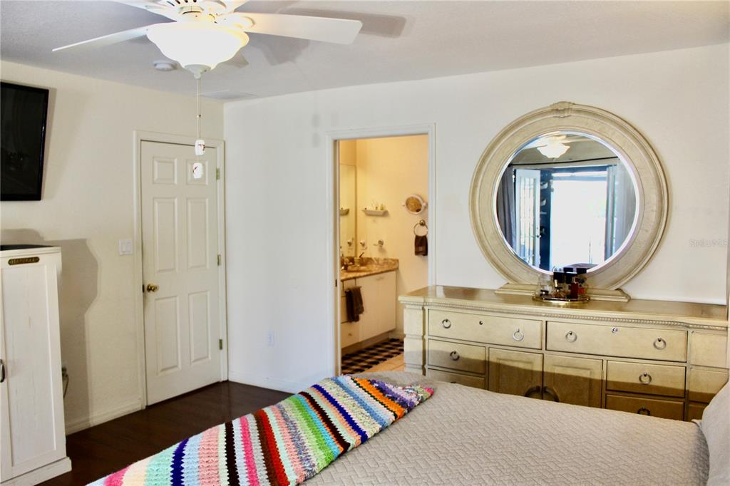 74 Belem Street Punta Gorda, FL 33983 - Photo 26 of 34 a living room with a bed and a mirror