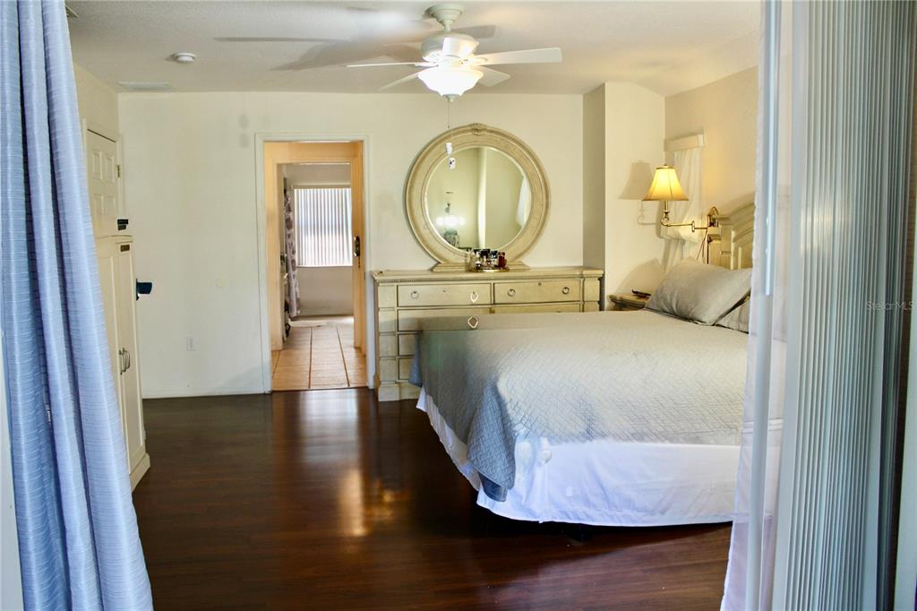 74 Belem Street Punta Gorda, FL 33983 - Photo 27 of 34 a bedroom with a bed mirror and a window