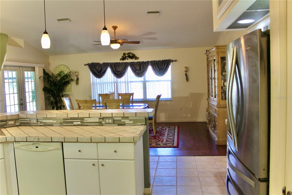 74 Belem Street Punta Gorda, FL 33983 - Photo 8 of 34 a kitchen with stainless steel appliances granite countertop a sink a stove and a refrigerator