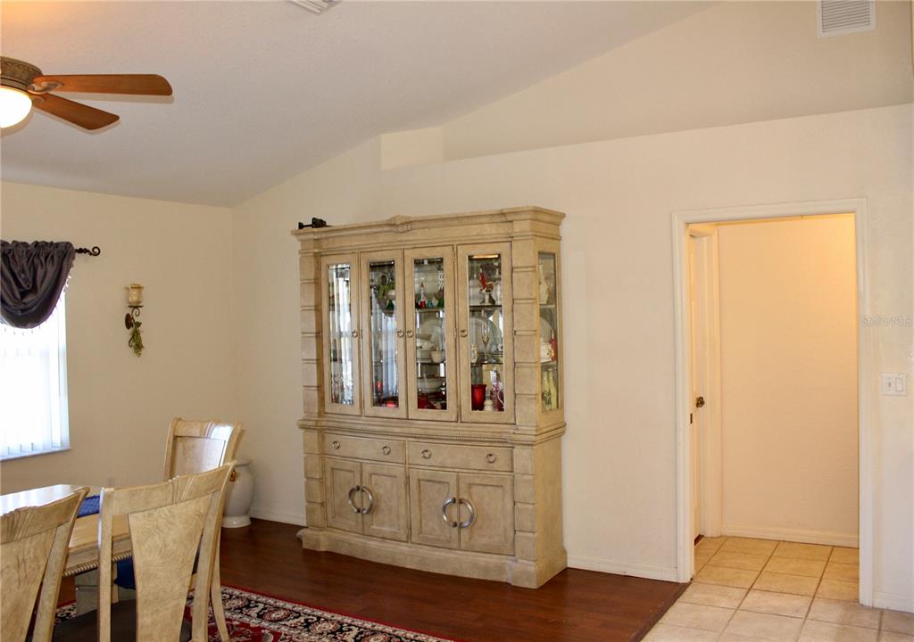 74 Belem Street Punta Gorda, FL 33983 - Photo 9 of 34 a view of a hallway with wooden floor and cabinet