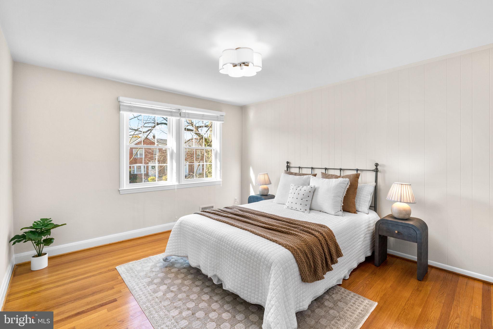 321 Stratford Road Baltimore, MD 21228 - Photo 12 of 34 a bedroom with bed and wooden floor