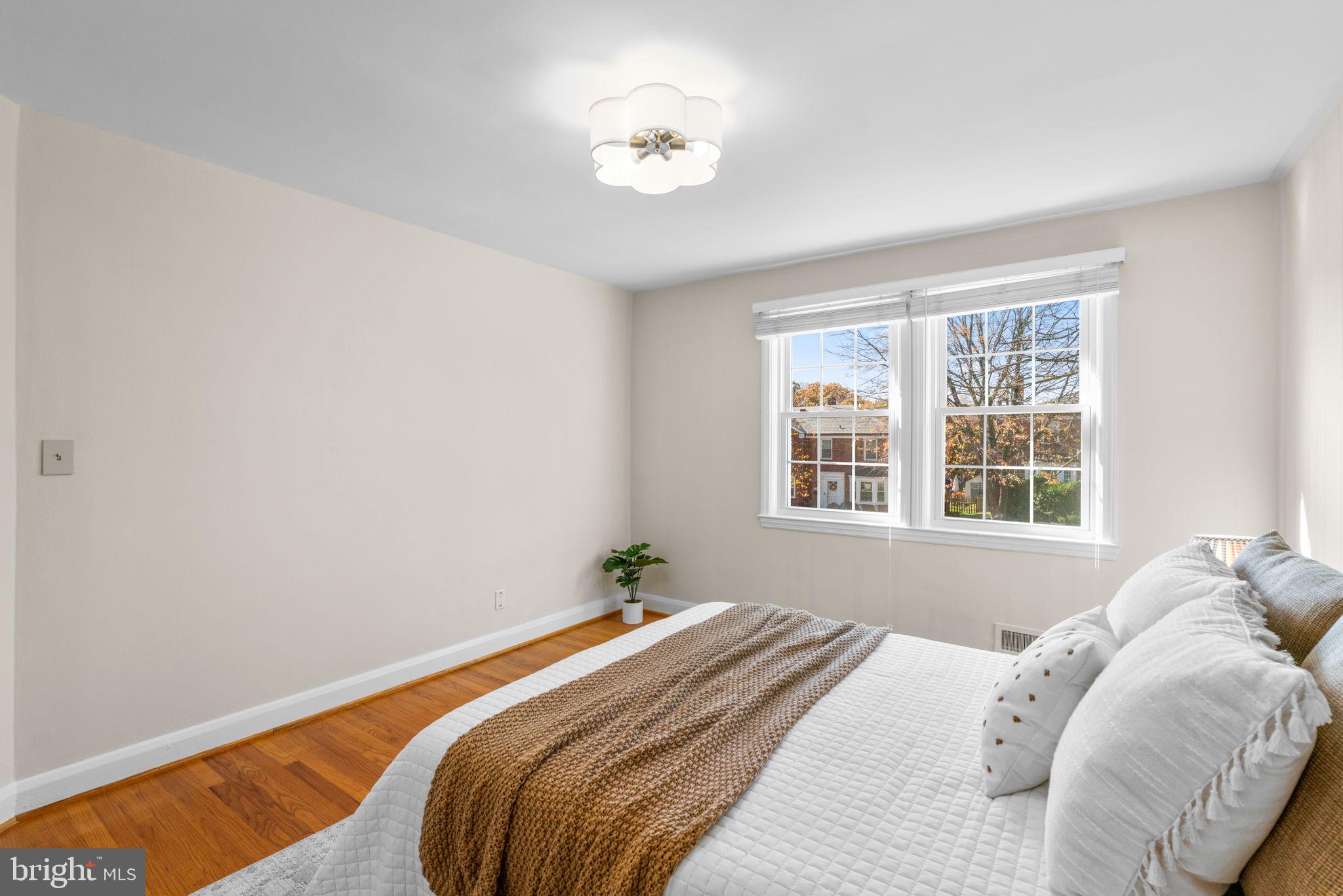 321 Stratford Road Baltimore, MD 21228 - Photo 14 of 34 a bedroom with a bed and a window