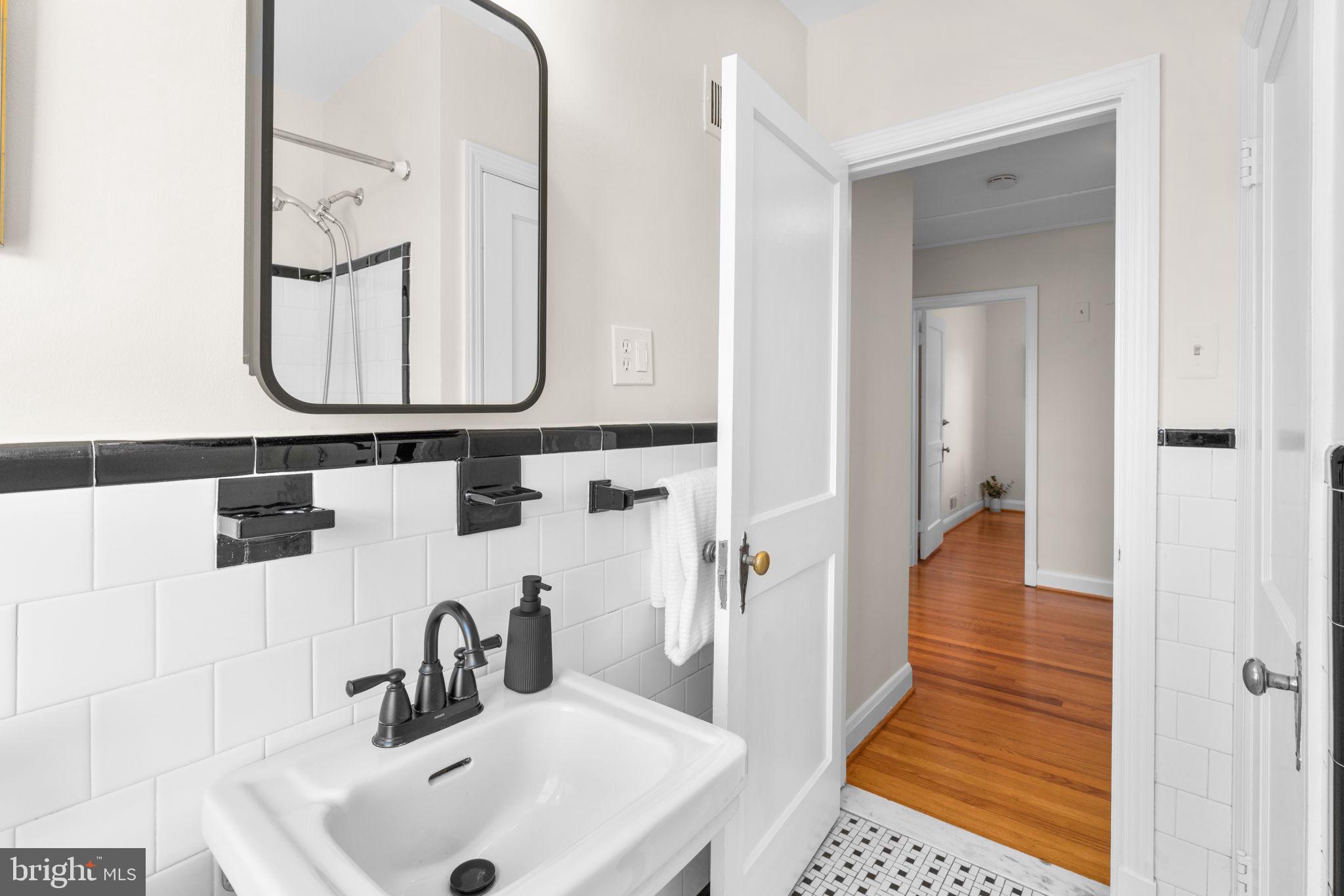 321 Stratford Road Baltimore, MD 21228 - Photo 17 of 34 a bathroom with a sink and a mirror