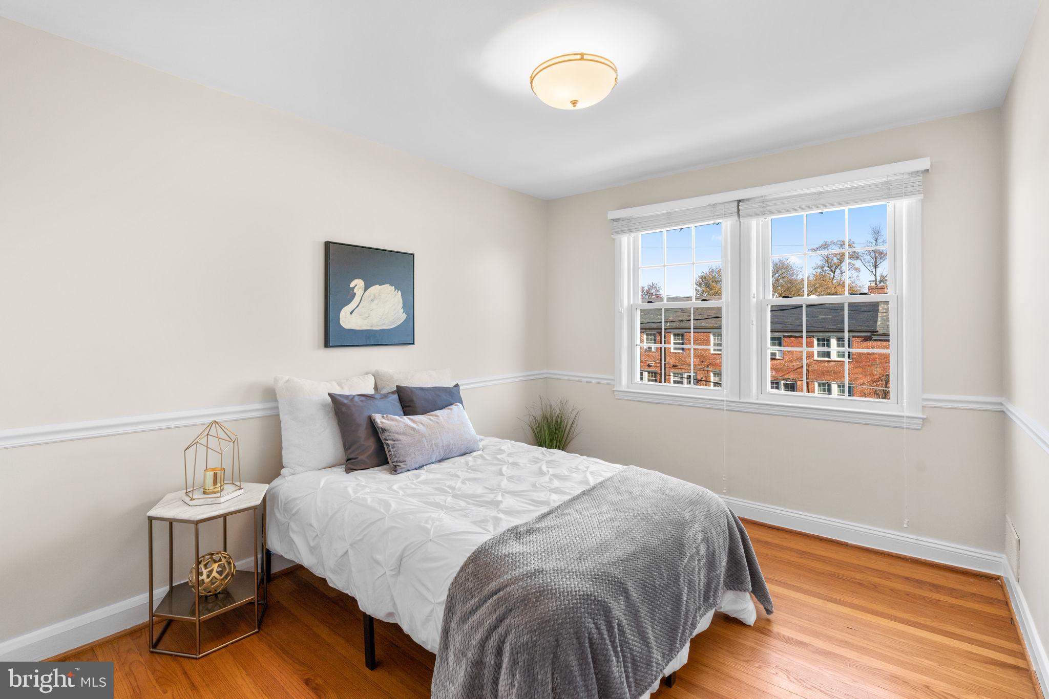 321 Stratford Road Baltimore, MD 21228 - Photo 18 of 34 a bedroom with a bed and wooden floor