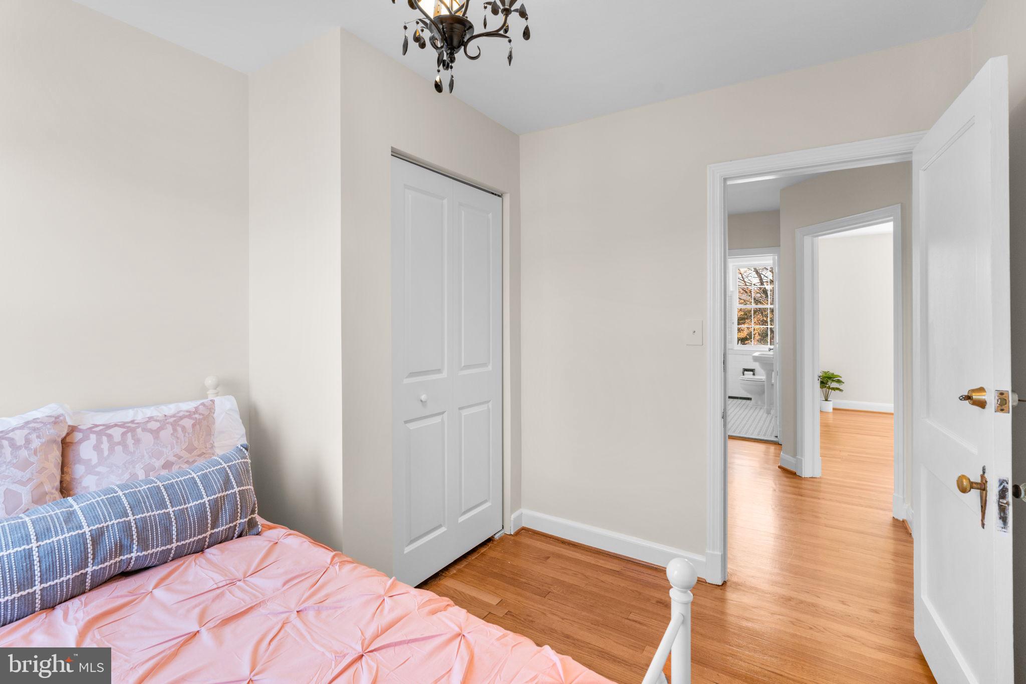 321 Stratford Road Baltimore, MD 21228 - Photo 20 of 34 a bedroom with a bed and wooden floor