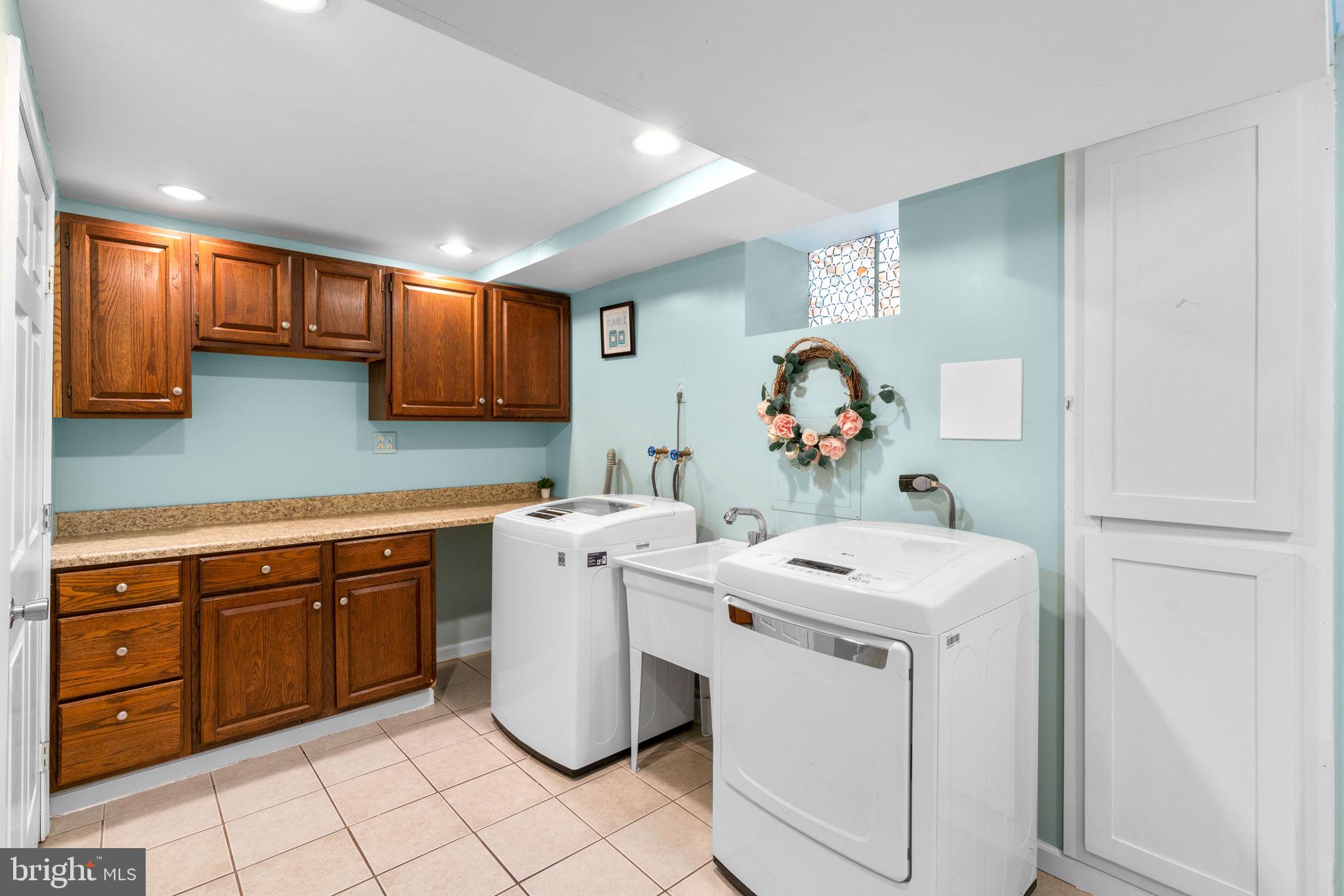 321 Stratford Road Baltimore, MD 21228 - Photo 24 of 34 a utility room with sink dryer and washer