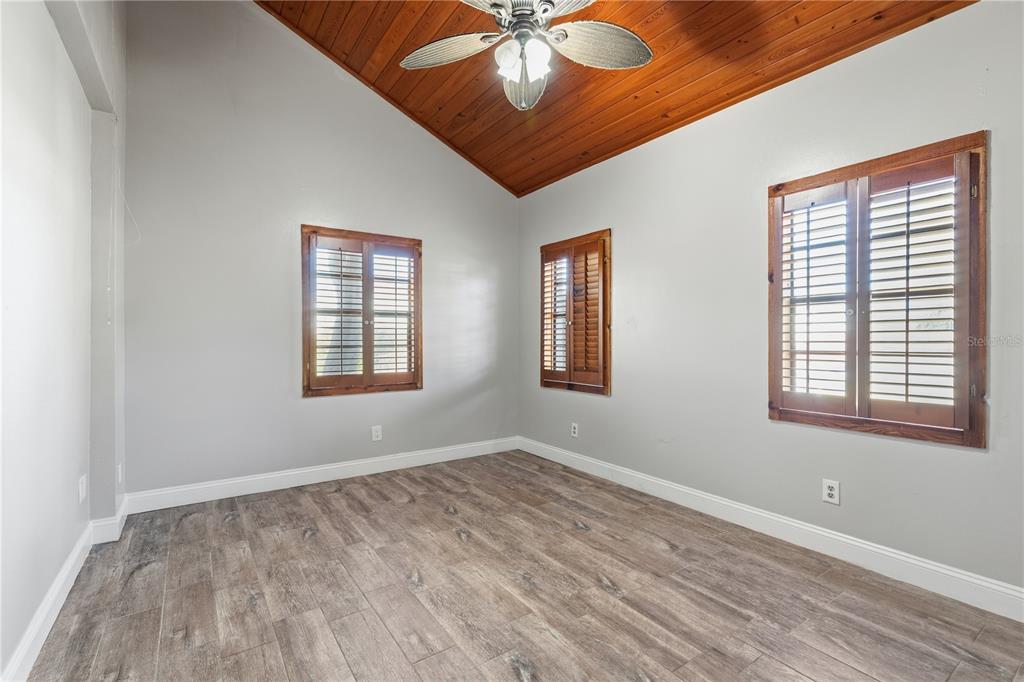 10301 Trail Ridge Lane Tampa, FL 33624 - Photo 14 of 35 a view of empty room with wooden floor and fan
