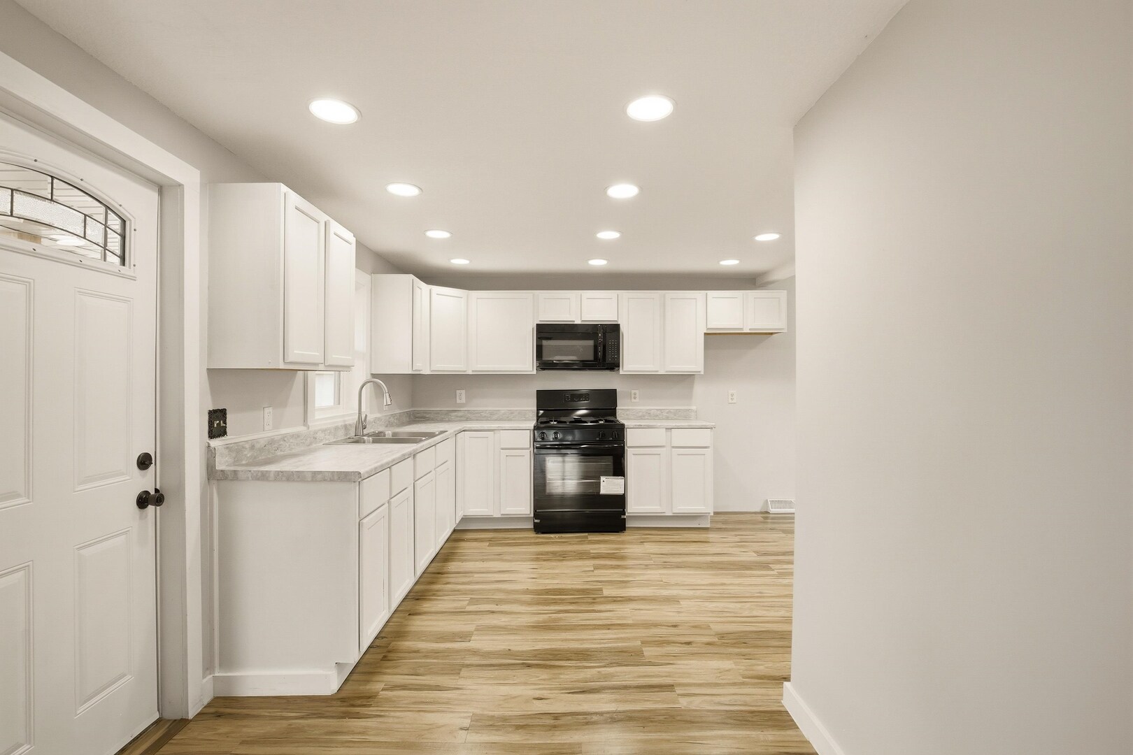 1928 8th Avenue Rock Island, IL 61201 - Photo 13 of 33 a kitchen with stainless steel appliances granite countertop a refrigerator and a stove top oven