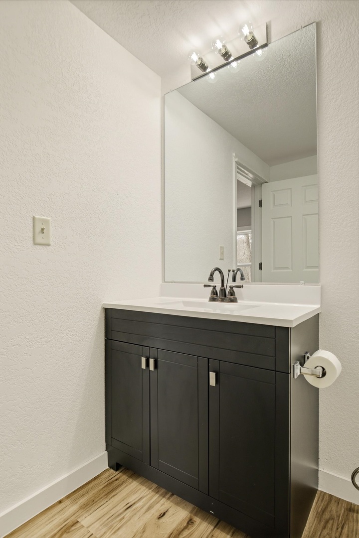 1928 8th Avenue Rock Island, IL 61201 - Photo 25 of 33 a bathroom with a sink vanity and a mirror