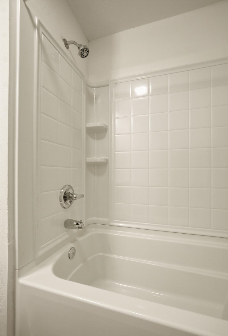 1928 8th Avenue Rock Island, IL 61201 - Photo 26 of 33 a bathroom with a shower and a bathtub