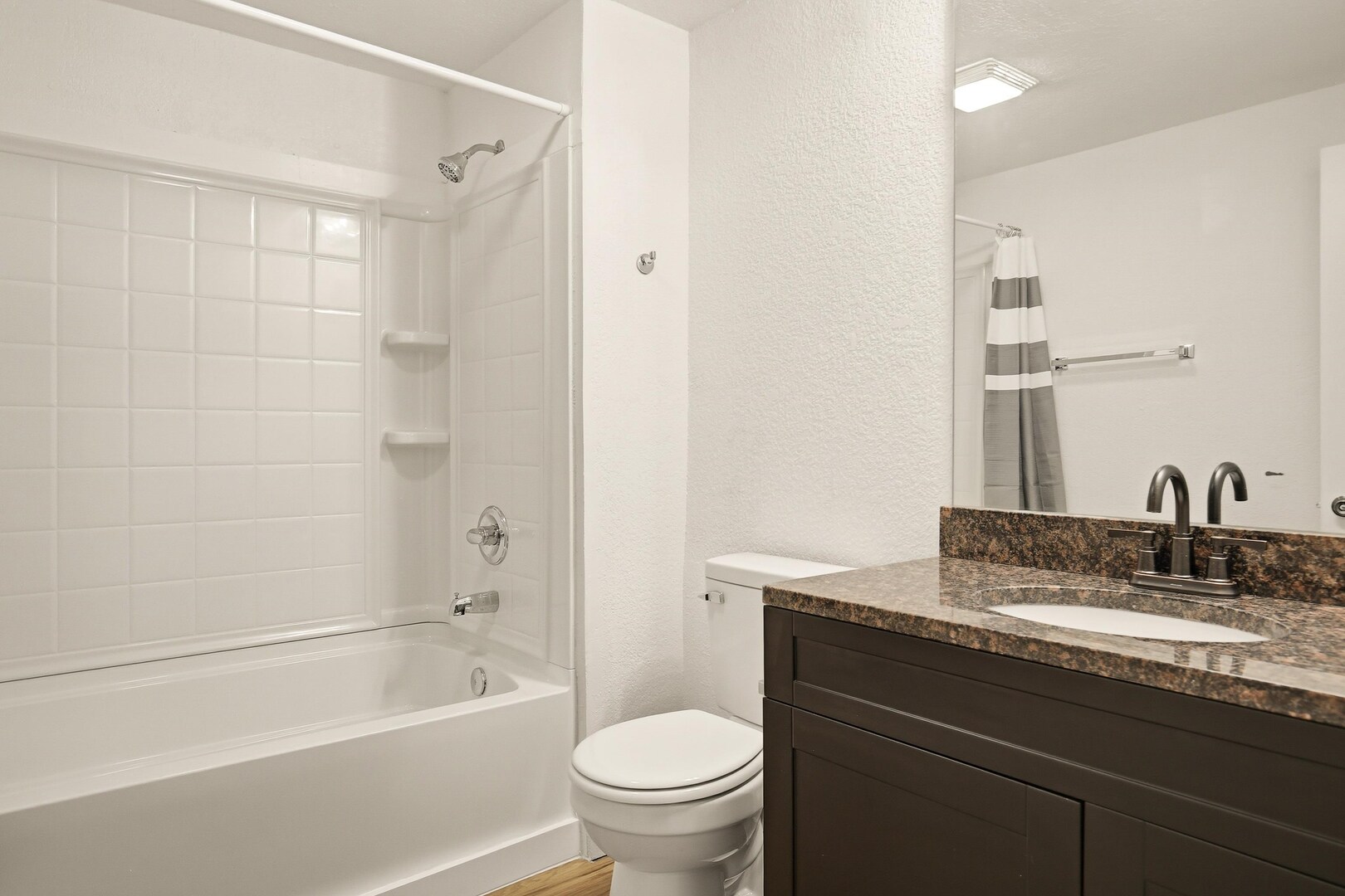 1928 8th Avenue Rock Island, IL 61201 - Photo 29 of 33 a bathroom with a granite countertop sink a toilet and shower