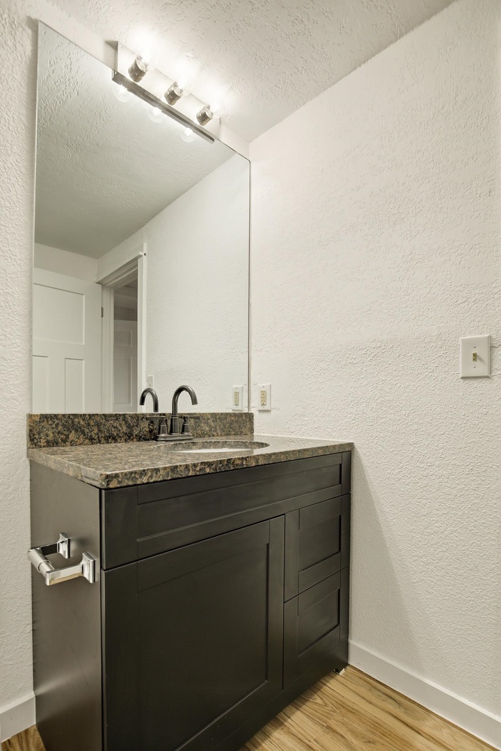 1928 8th Avenue Rock Island, IL 61201 - Photo 30 of 33 a bathroom with a granite countertop sink and a mirror
