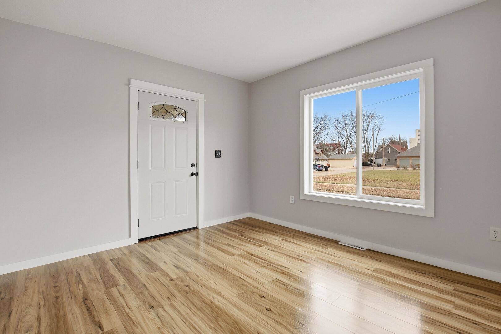 1928 8th Avenue Rock Island, IL 61201 - Photo 8 of 33 a view of empty room with window and wooden floor