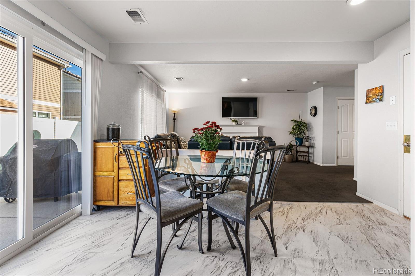 19525 Robins Drive Denver, CO 80249 - Photo 12 of 44 a dining room with furniture and window