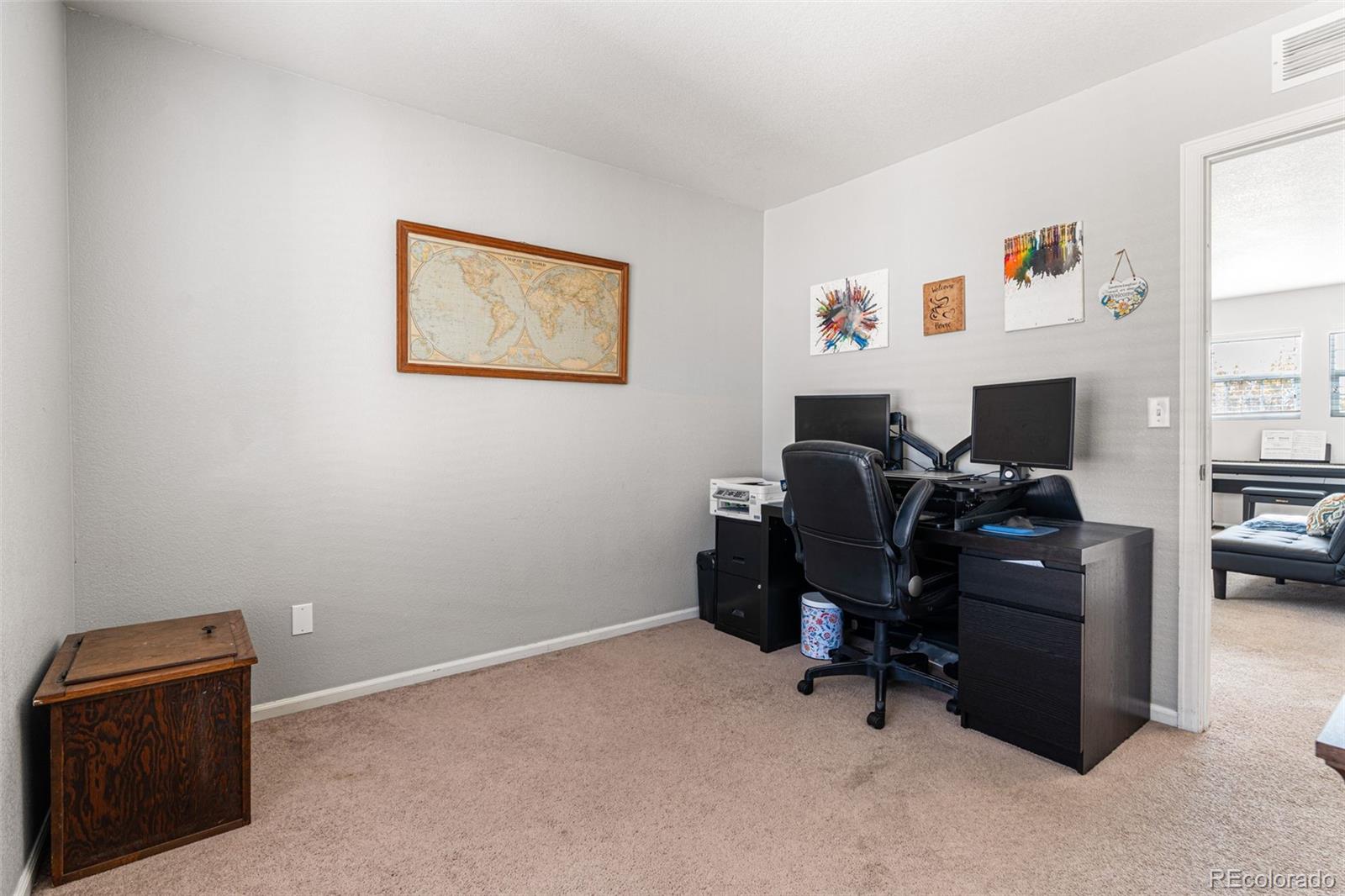 19525 Robins Drive Denver, CO 80249 - Photo 32 of 44 a view of a workspace with furniture and a window