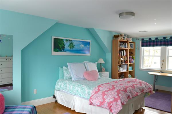 21 Dane Road Lexington, MA 02421 - Photo 17 of 25 a bedroom with a bed and a bookshelf with wooden floor