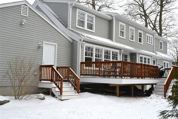 21 Dane Road Lexington, MA 02421 - Photo 25 of 25 a view of a house with a bench in a patio