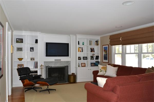 21 Dane Road Lexington, MA 02421 - Photo 6 of 25 a living room with furniture a flat screen tv and a fireplace