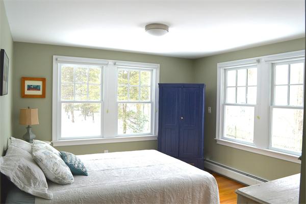 21 Dane Road Lexington, MA 02421 - Photo 8 of 25 a bedroom with a bed and a window