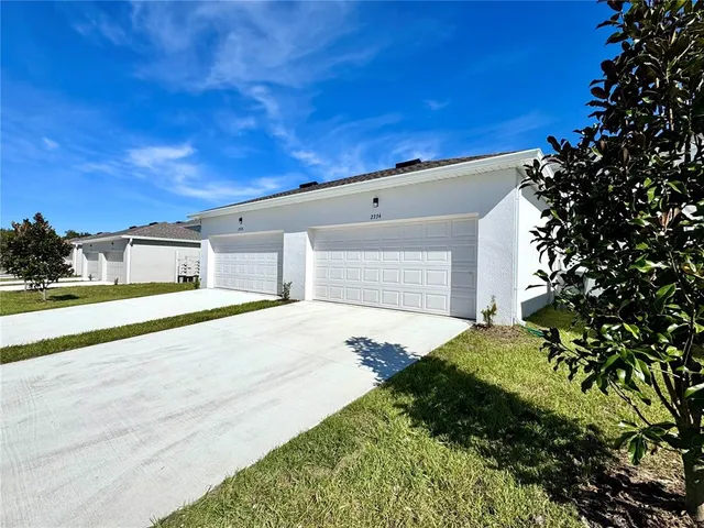 a house view with a backyard space
